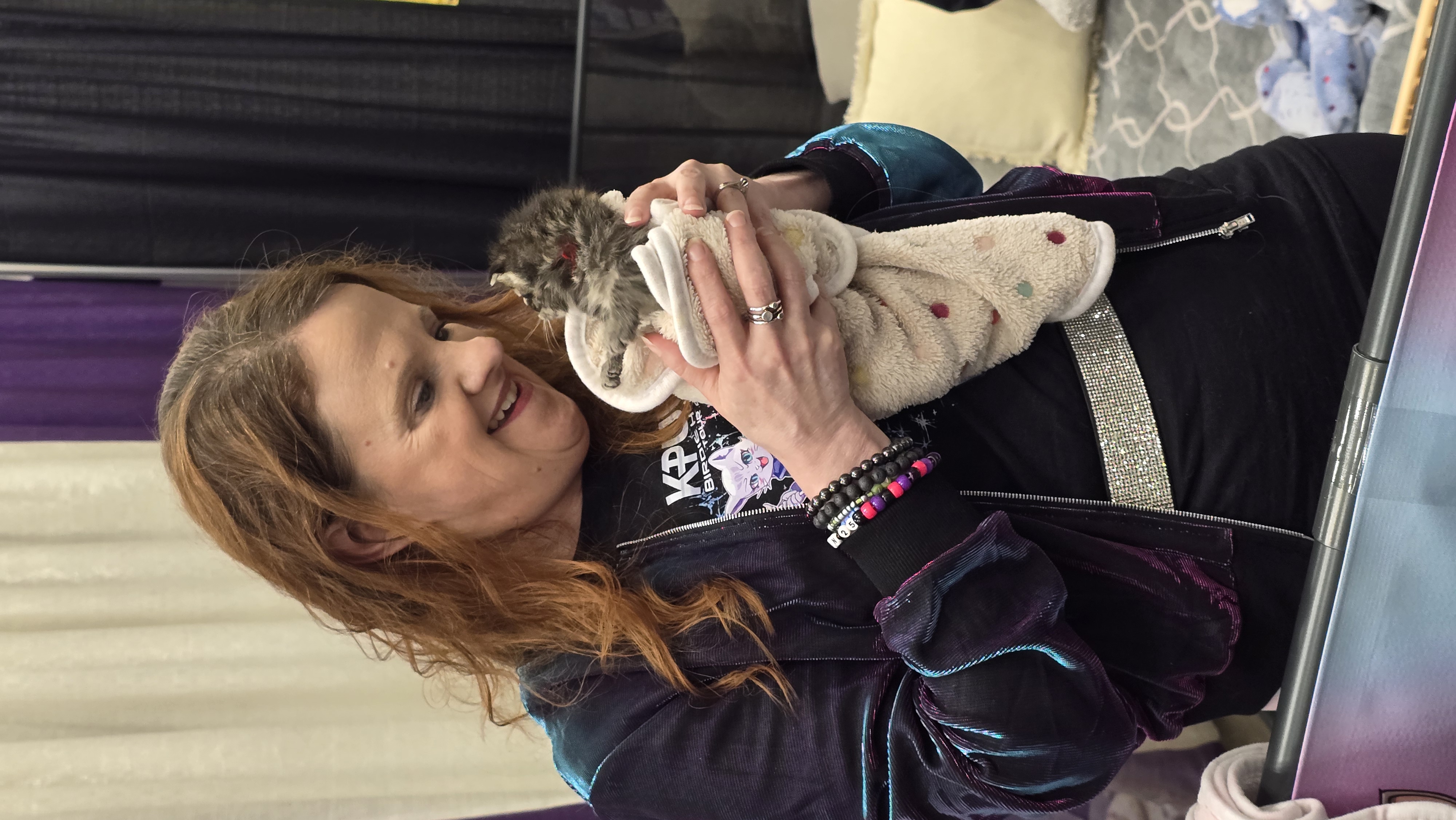 KJ holding a tiny kitten